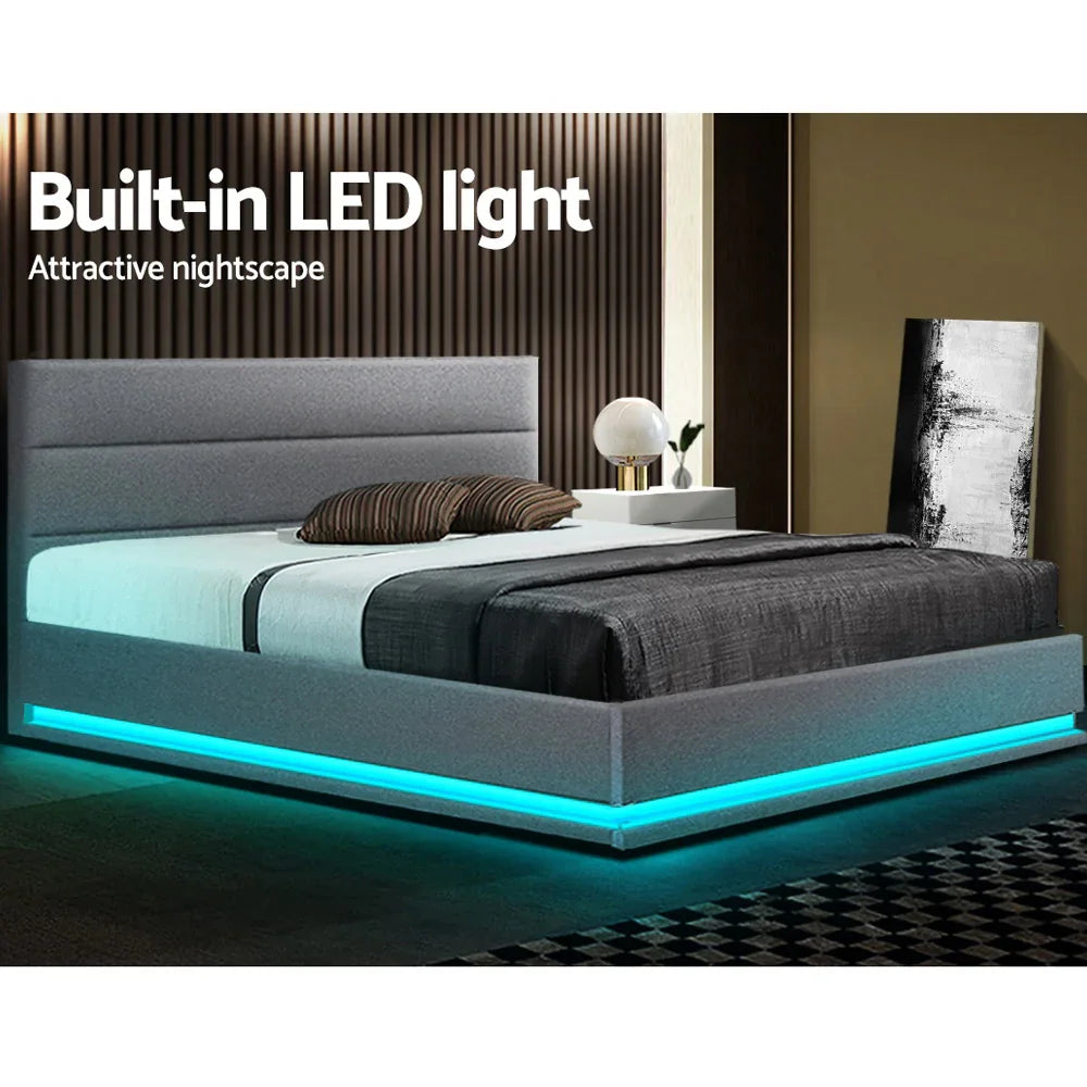 Modern gray upholstered bed with built-in blue LED lights in stylish bedroom setting