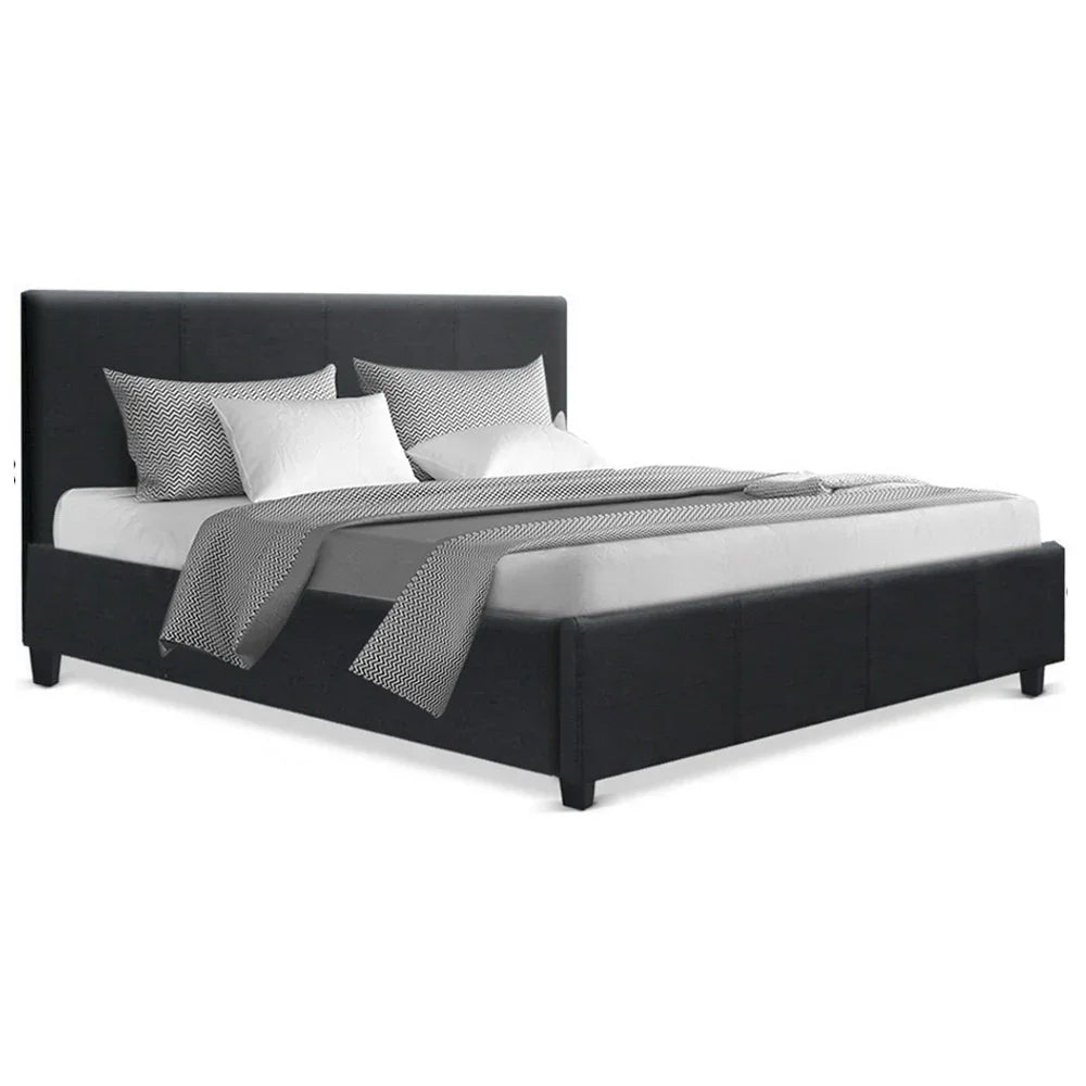 Modern black upholstered bed with textured gray bedding and white pillows on white background