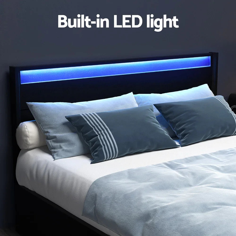 Modern bed with built-in blue LED light in black headboard and grey-blue bedding