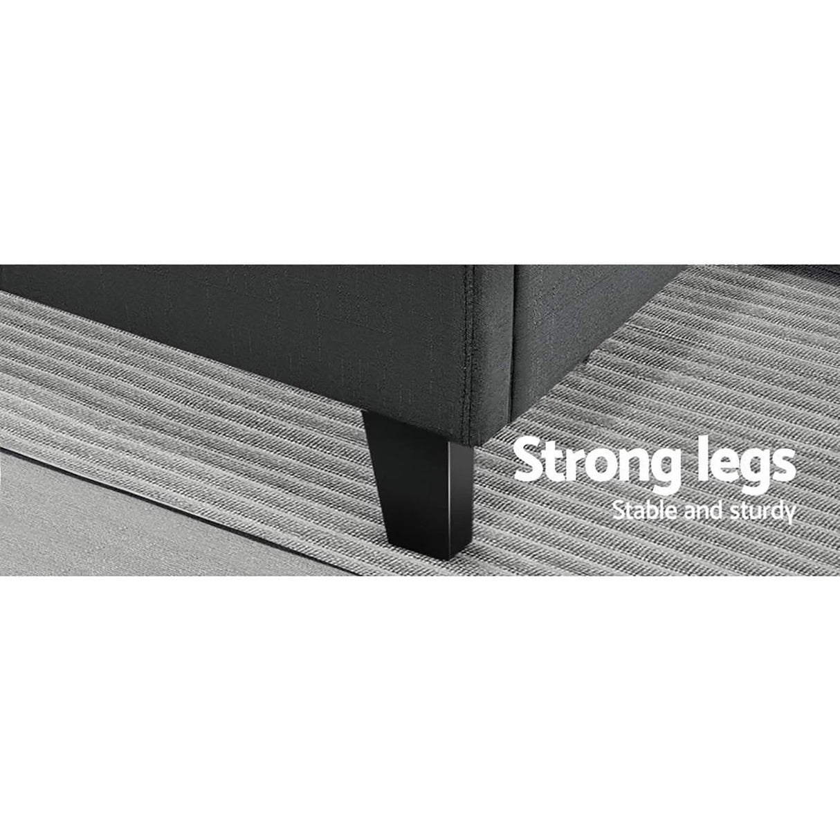 Close-up of black couch leg on striped gray rug highlighting strong, sturdy furniture support