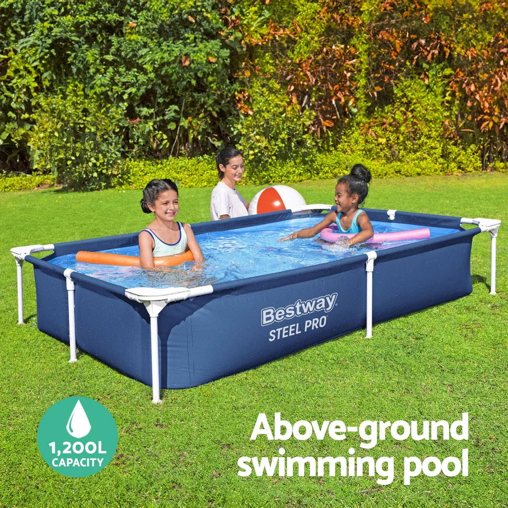 Two girls playing in a Bestway Steel Pro above-ground pool with water noodles and an adult nearby in a green backyard