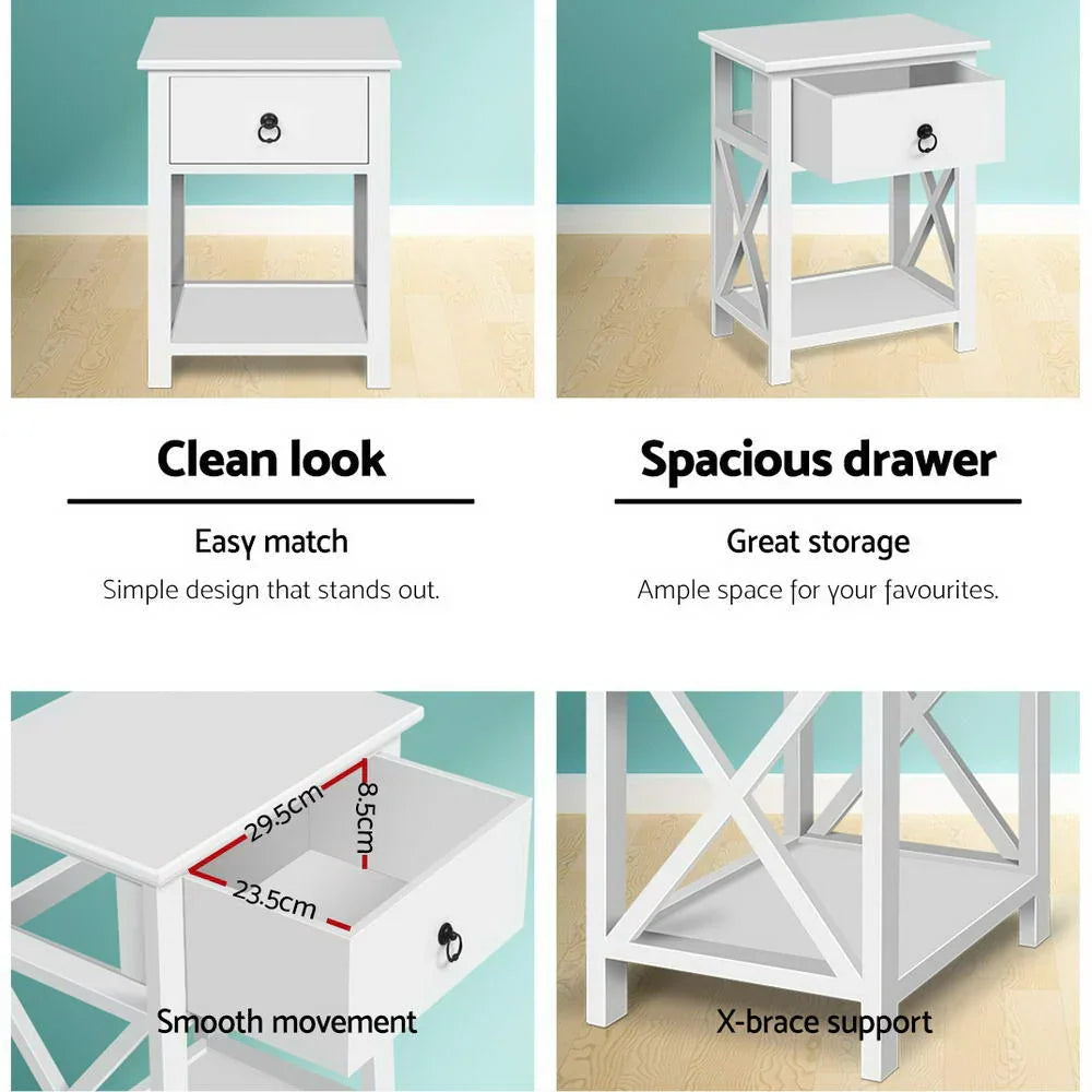 White bedside table with single drawer, lower shelf, X-brace support, and clean modern design.