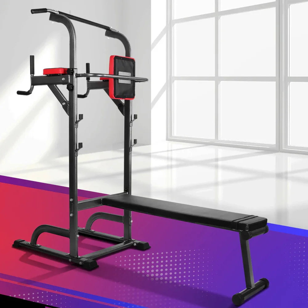 Black and red home gym workout station with pull-up bar and flat bench in bright room
