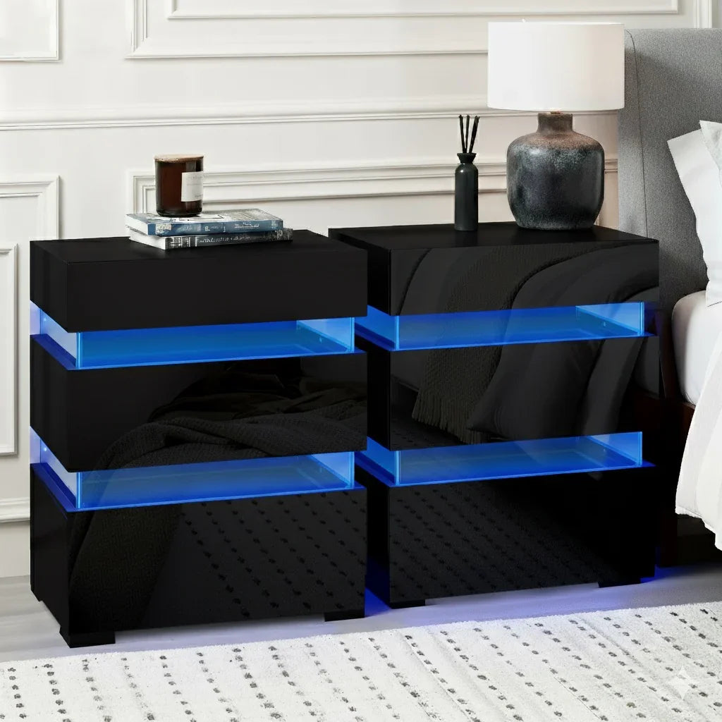 Modern black LED bedside tables with blue lighting, lamp, and books in a bedroom setting