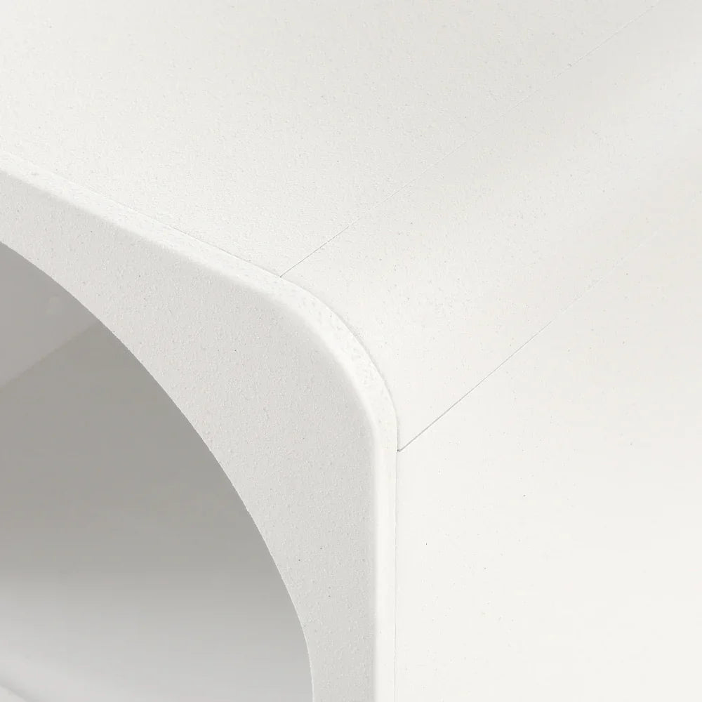 Close-up of modern white minimalist furniture with smooth rounded corner detail