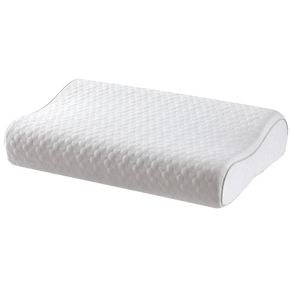 White contoured memory foam pillow with textured hexagonal pattern and green piping
