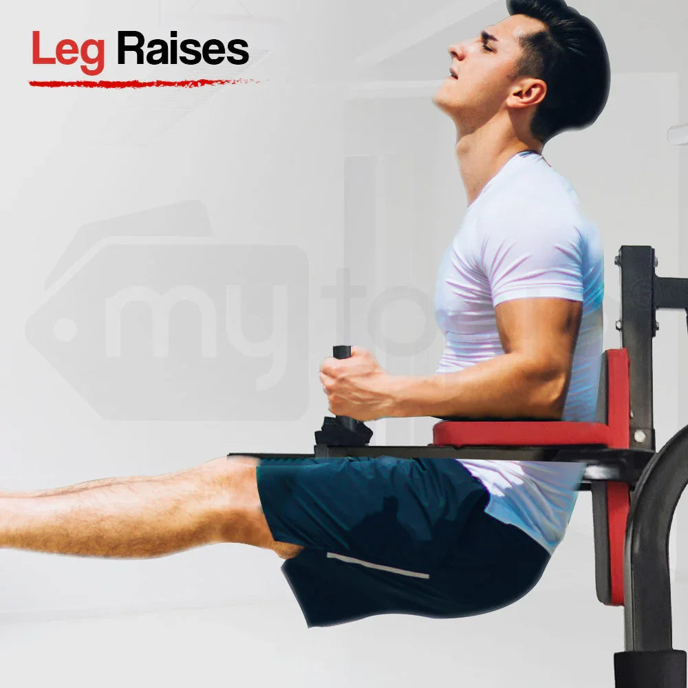 Man performing leg raises on gym equipment, core workout, athletic training, fitness exercise