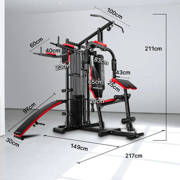 Multi-station home gym with red-black accents, labeled dimensions, in a bright room