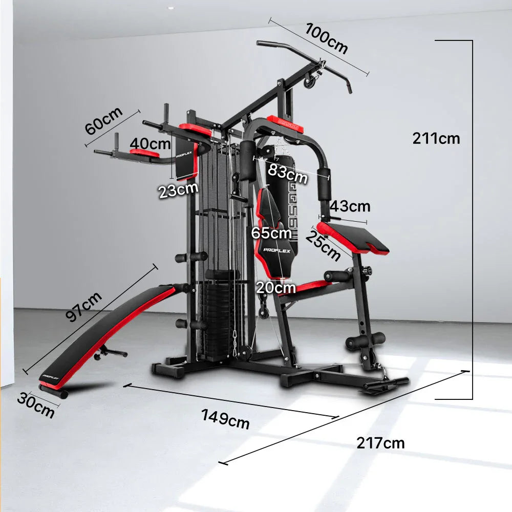 Multi-station home gym with red-black accents, labeled dimensions, in a bright room