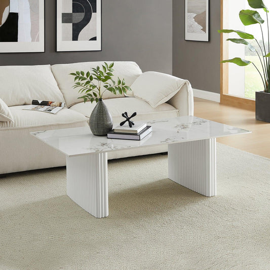 Modern living room with white marble coffee table, cream sofa, and minimalist decor