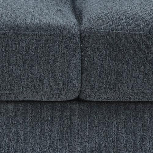 Close-up of dark gray textured upholstered sofa cushions