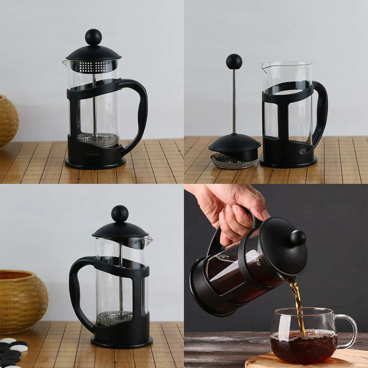 Black French press coffee maker on wooden board, with assembly parts and pouring brewed coffee