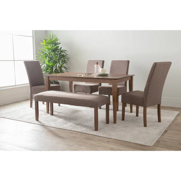 Modern dining room set with brown upholstered chairs, bench, wooden table, and indoor plant