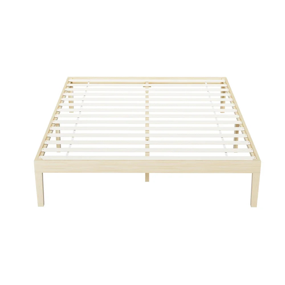 Minimalist natural wood slatted bed frame with sturdy legs on white background