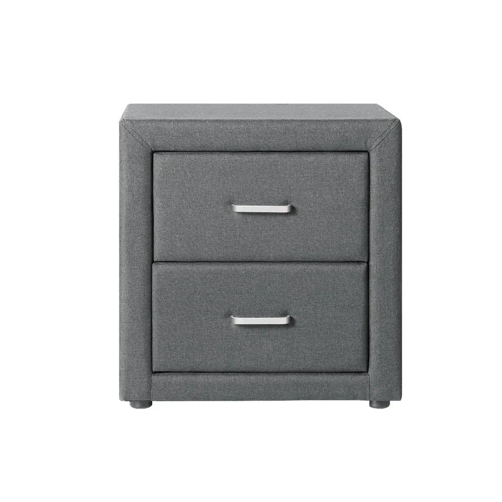 Modern gray fabric nightstand with two drawers and metal handles on white background