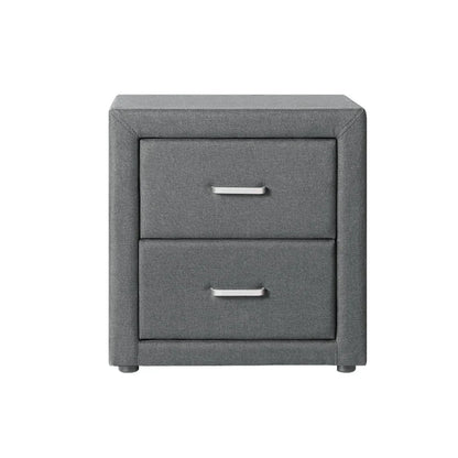 Modern gray fabric nightstand with two drawers and metal handles on white background