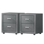 Pair of modern gray fabric nightstands with two drawers and sleek metal handles