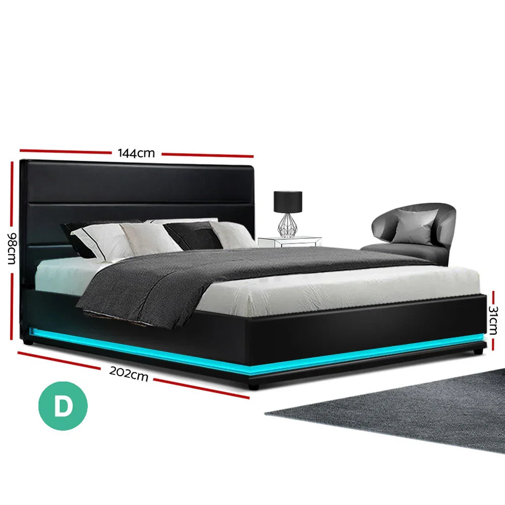 Modern black leather bed with LED base lighting, gray bedding, side table with lamp, and gray armchair