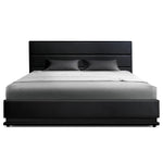 Modern black leather bed frame with matching headboard and gray bedding