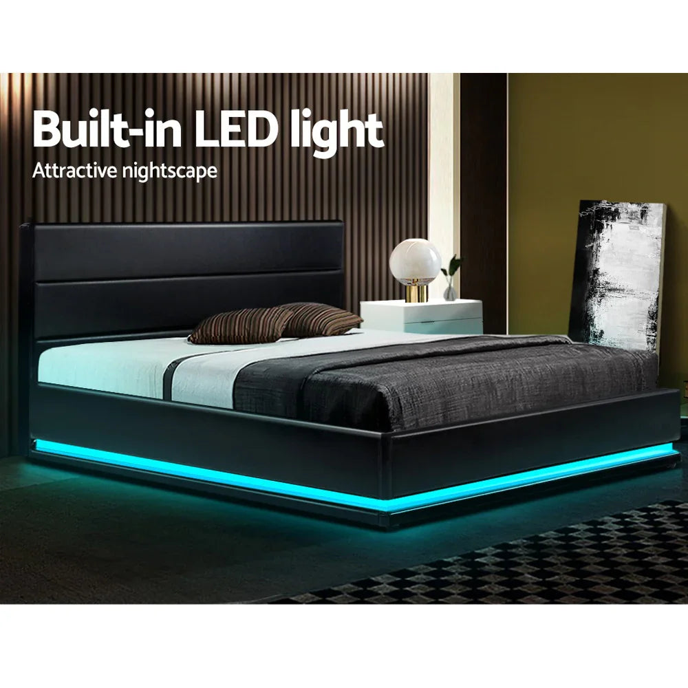 Modern black bed with built-in blue LED light strip in stylish bedroom with nightstand and decorative painting