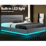 Modern gray upholstered bed with built-in blue LED lights in stylish bedroom setting