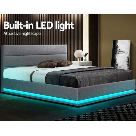 Modern gray upholstered bed with built-in blue LED lights in stylish bedroom setting