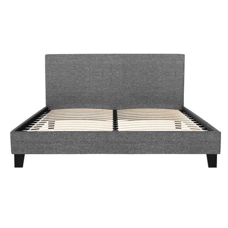 Modern gray upholstered platform bed frame with wooden slats and tall headboard