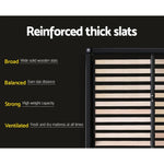 Close-up of reinforced wooden bed slats in black frame with text highlighting broad, balanced, strong, ventilated features