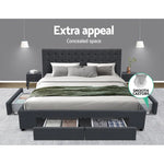 Modern grey upholstered bed with storage drawers and side compartments in stylish bedroom