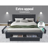 Modern grey upholstered bed with storage drawers and side compartments in stylish bedroom