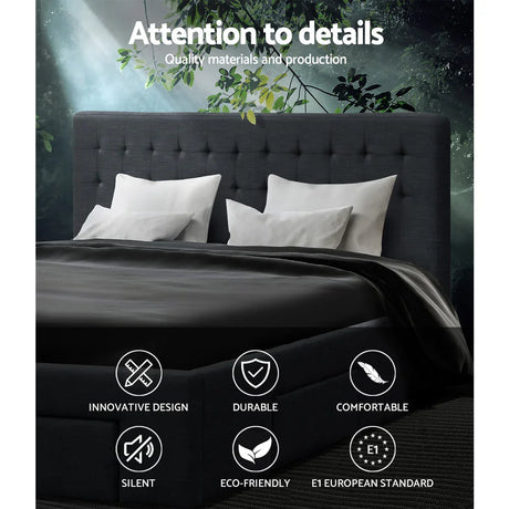 Dark gray upholstered bed with white pillows and black bedding under green leafy branches with quality and design icons