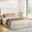 Modern bedroom with beige upholstered platform bed, patterned pillows, brown throw, and bright window blinds