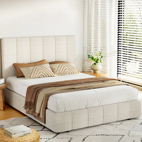 Modern bedroom with beige upholstered platform bed, patterned pillows, brown throw, and bright window blinds