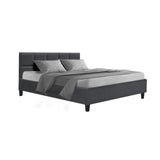 Modern gray upholstered platform bed with tufted headboard, gray bedding, and pillows