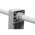 Close-up of gray plastic joint with tube connecting in gray tool or equipment part