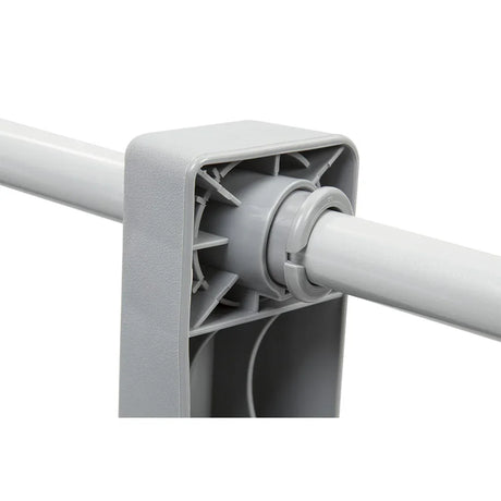 Close-up of gray plastic joint with tube connecting in gray tool or equipment part