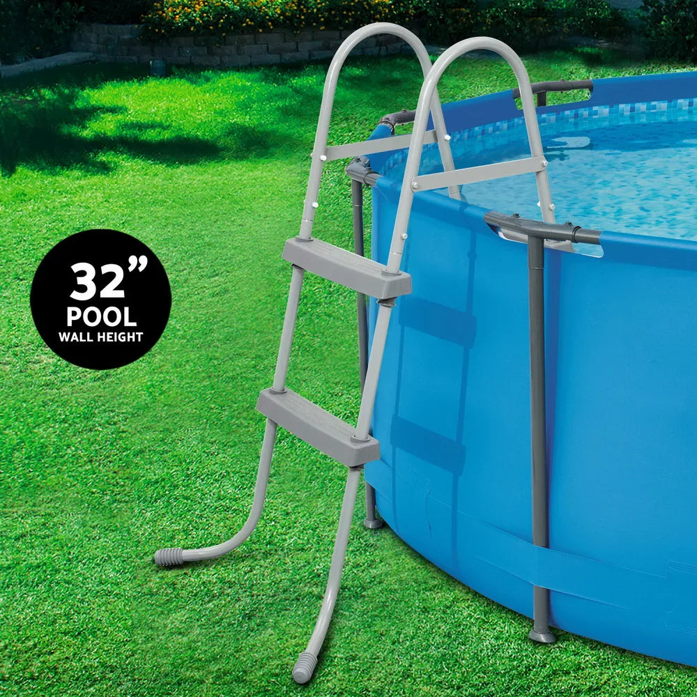 32-inch wall height blue above ground pool with gray safety ladder on green grass