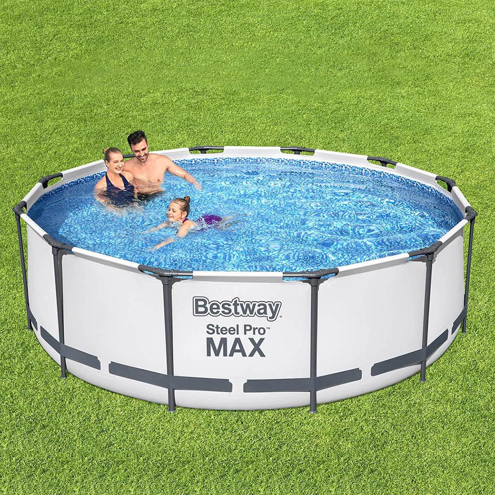 Bestway Steel Pro Max round above ground pool with family enjoying in clear water on green grass