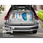 Open trunk of silver SUV with Bestway Steel Pro pool box inside on driveway