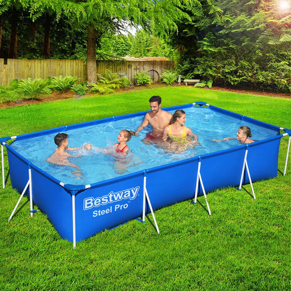 Family enjoying outdoor swimming in a blue Bestway Steel Pro rectangular above ground pool on green grass