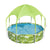 Round above ground pool with green tropical leaf pattern and green canopy shade