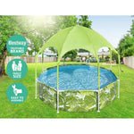 Family-size Bestway above ground pool with tropical leaf print and green canopy in backyard