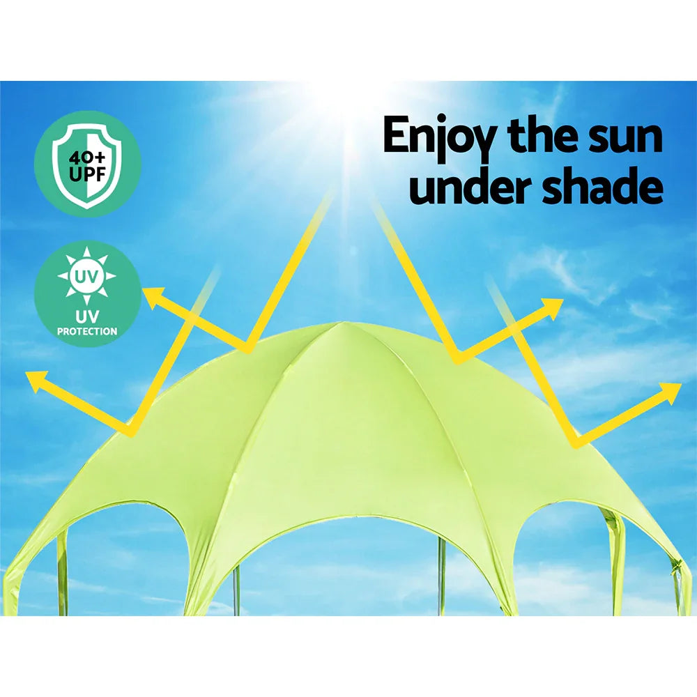 Green outdoor canopy tent under bright sun with UV protection and 40+ UPF shield icons