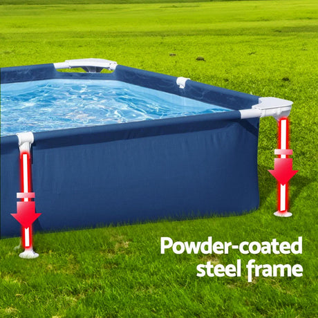 Above ground blue rectangular pool with powder-coated steel frame on green grass lawn