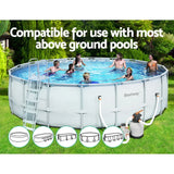 People enjoying a round Bestway above ground pool with ladder and filter pump in a green garden