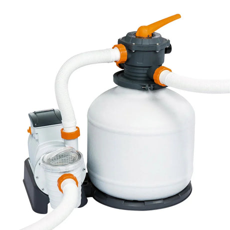 White and gray sand filter pump with orange valves and white hoses for pool water filtration