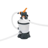 gray and white pool sand filter with orange handle and connected white hoses