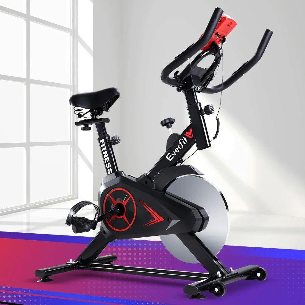 Everfit indoor stationary spin bike with digital display in modern home gym setting