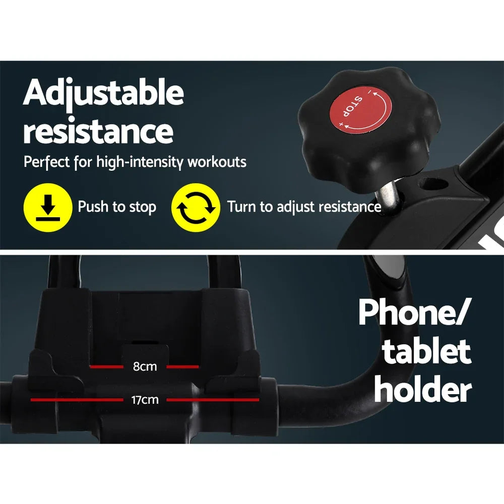 Exercise bike features adjustable resistance knob and phone or tablet holder mount.