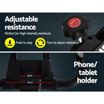 Exercise bike features adjustable resistance knob and phone or tablet holder mount.